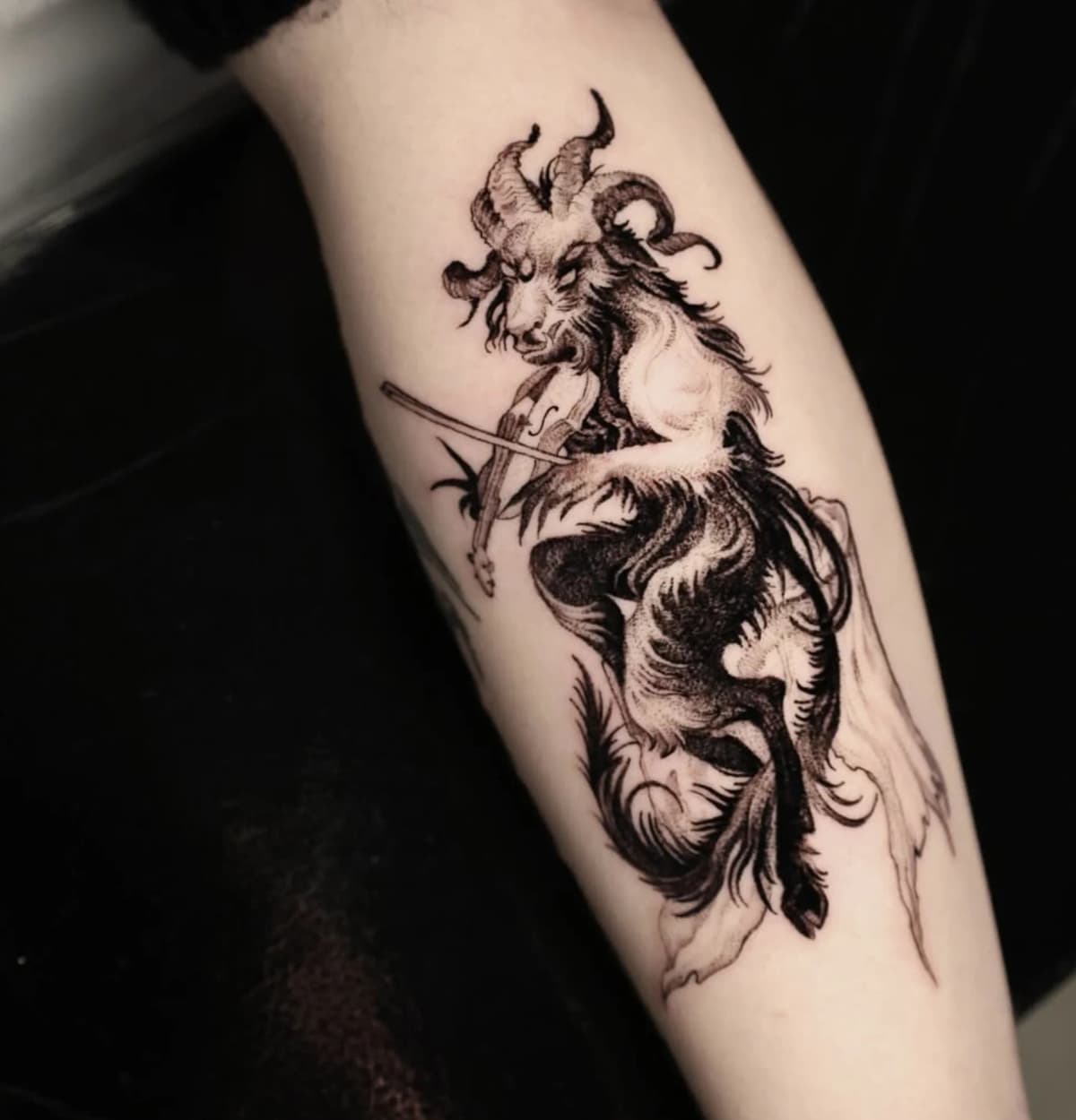 Horned goat creature with sword